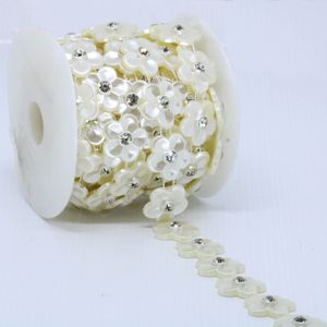 ALJOFRE FLOR PEROLADA COM STRASS 24MM EM ABS COM 5 METROS