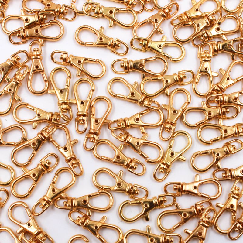 FECHO-MOSQUETAO-BASE-ARREDONDADA-23MM-EM-ZAMAK-COM-10-PECAS-DOURADO