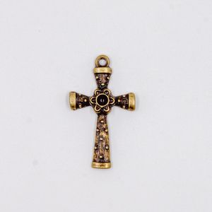 PINGENTE CRUZ COM FLOR TRABALHADA 47X28MM EM ZAMAC O KG