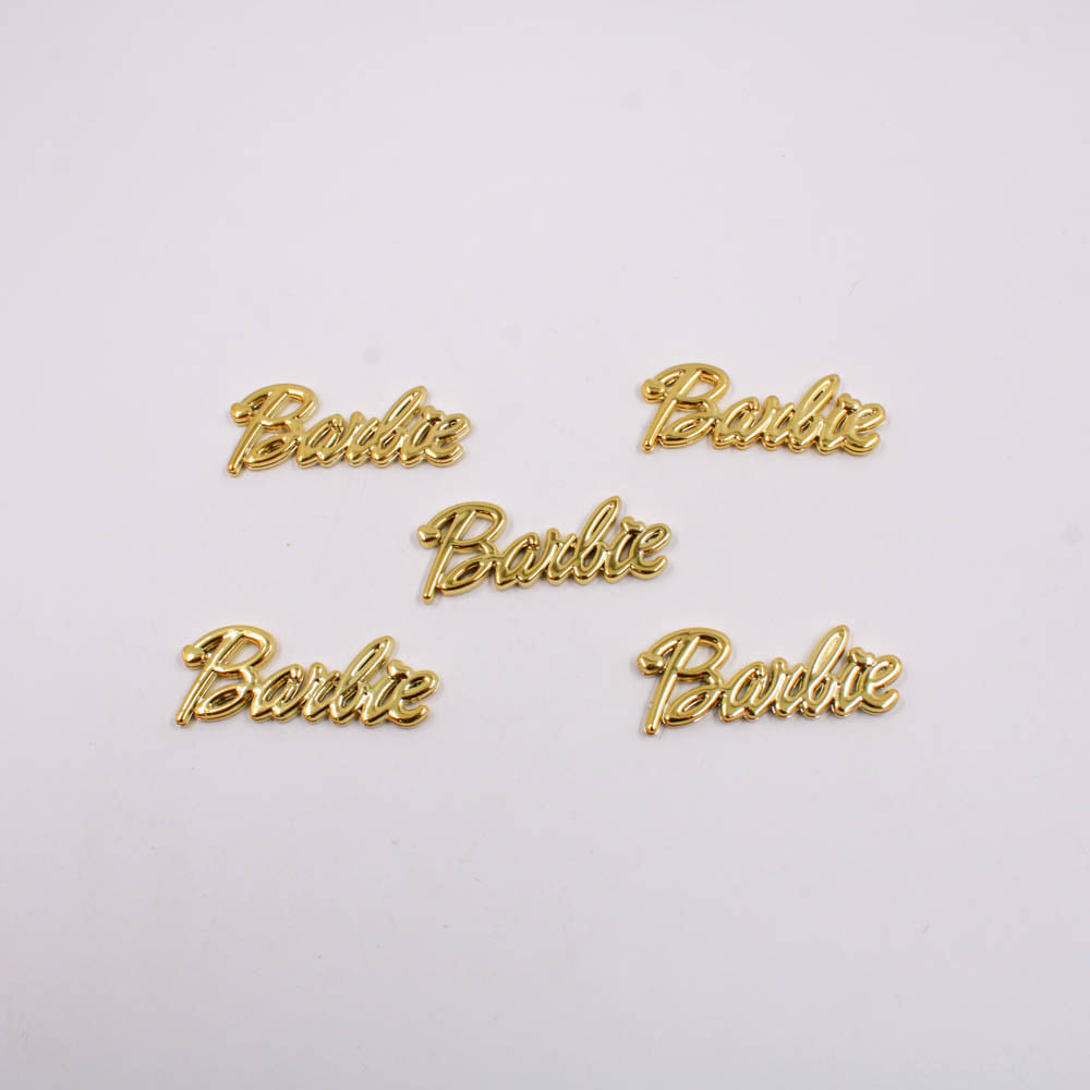 APLIQUE-LOGO-BARBIE-50X19MM-EM-PLASTICO-COM-50-PECAS---DOURADO