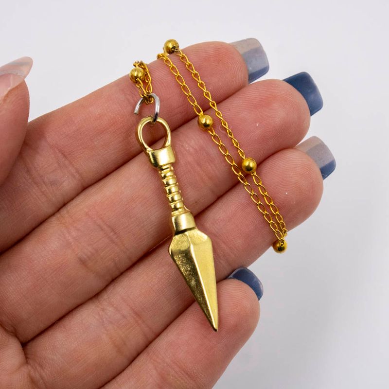 PINGENTE-KUNAI-P-41X08MM-EM-ZAMAC-COM-12-PECAS---DOURADO