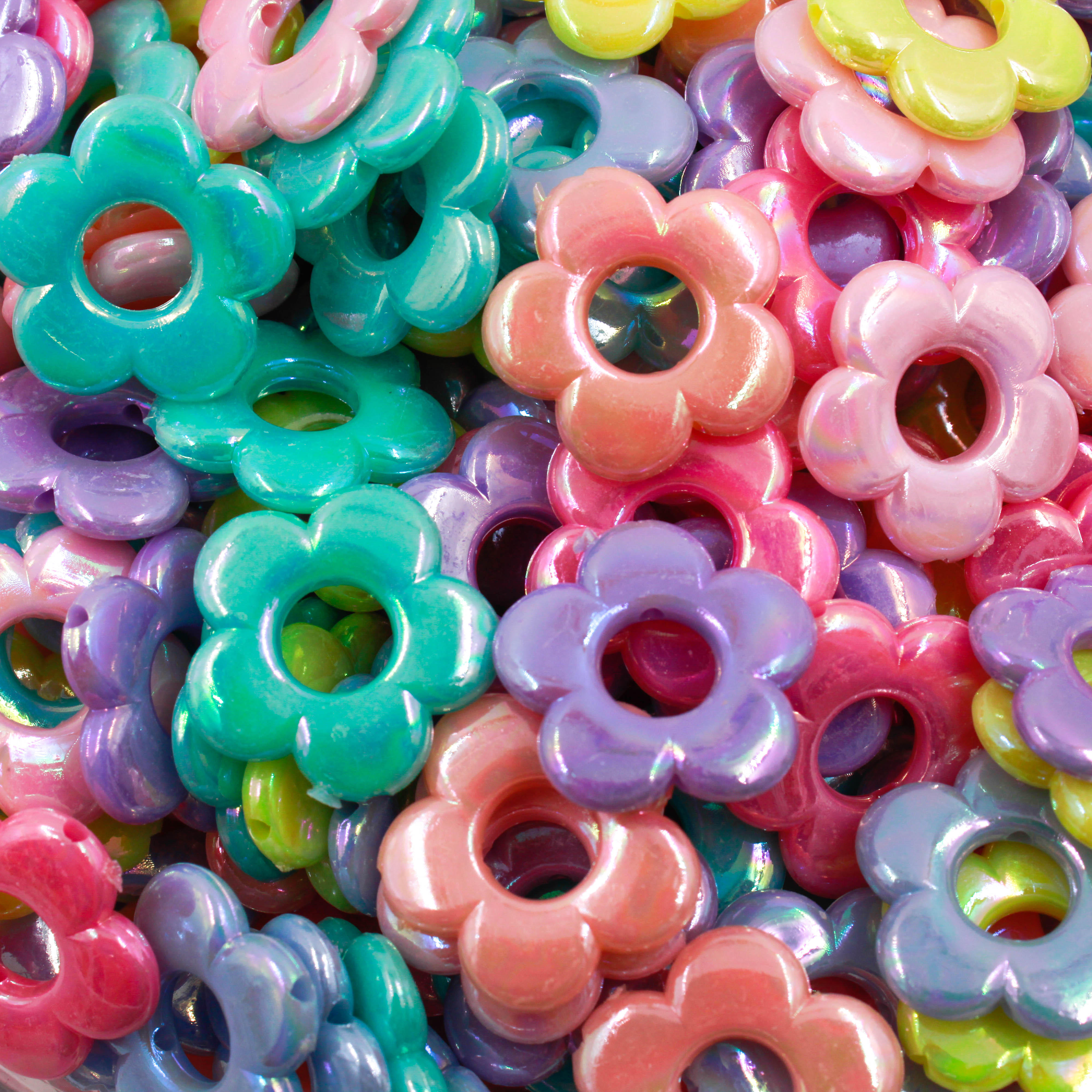 ENTREMEIO FLOR VAZADO IRISADA 20MM EM ACRILICO COM 50GR