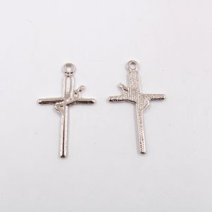 PINGENTE CRUZ FE 33X19MM EM ZAMAC COM 100GR